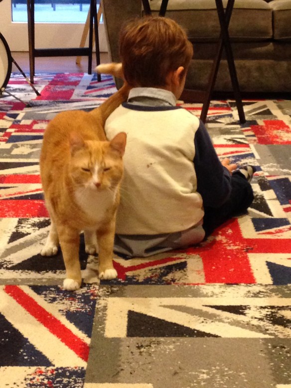 Martin, assisted by his partner-in-crime, George the Cat, plays in our family room.