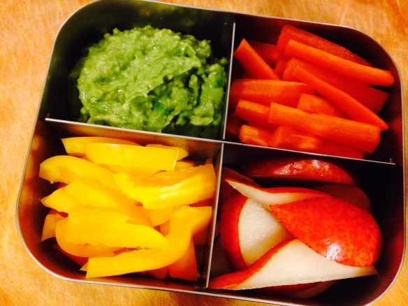 Martin's school lunch today: a dippin' plate with carrots, yellow bell pepper, avocado-and-fermented-garlic dip, and pear.